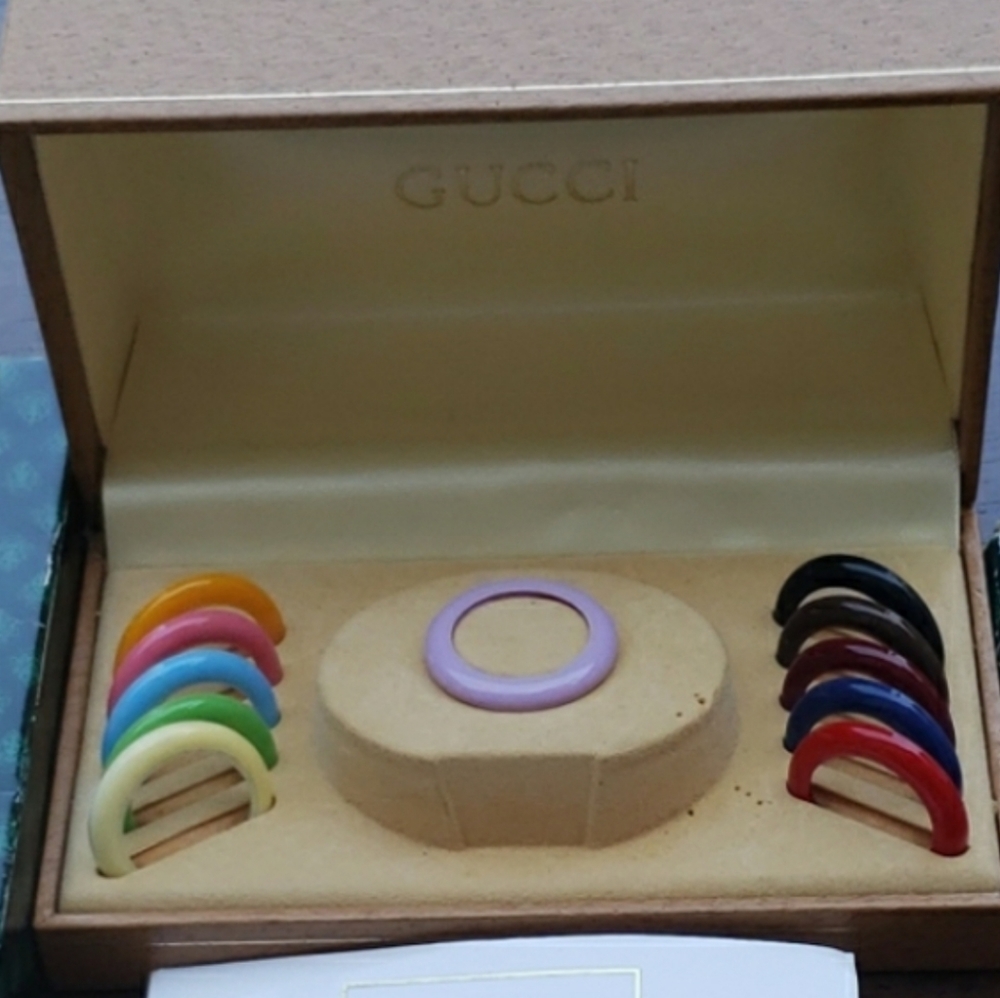 11 Gucci Bezels with original box.